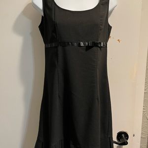 Teeze Me LBD with cute bow accent and pleated hemline. Size 7